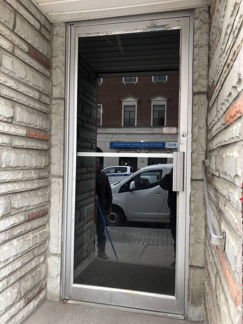 Replacement glass panel fitted into a commercial storefront opening in Ottawa