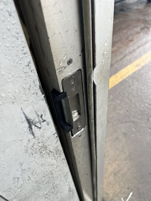 An electric strike installed and aligned in a commercial Ottawa door frame for access control