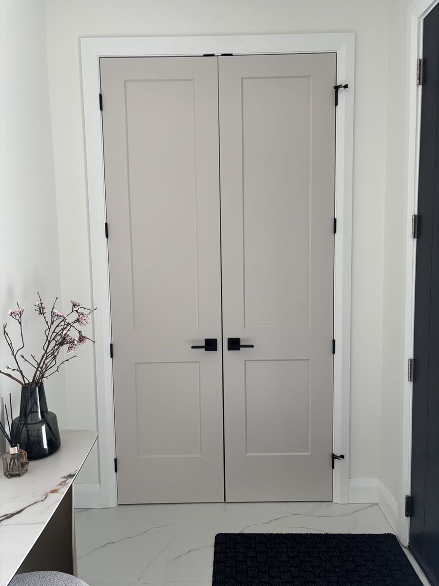 Folding bifold closet doors realigned to meet flush with even gaps at an Ottawa home