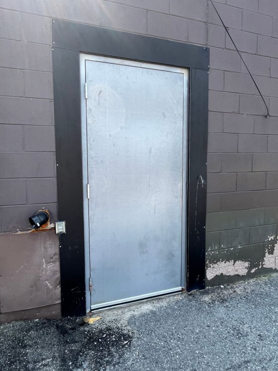 Commercial steel door serviced at an Ottawa business