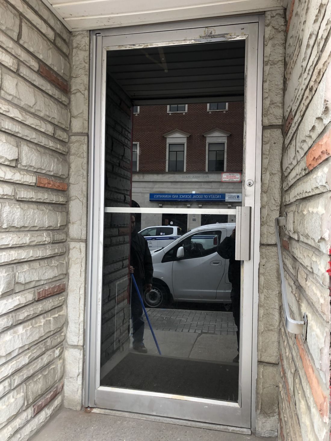 Replaced glass panel in an aluminum storefront door in Ottawa