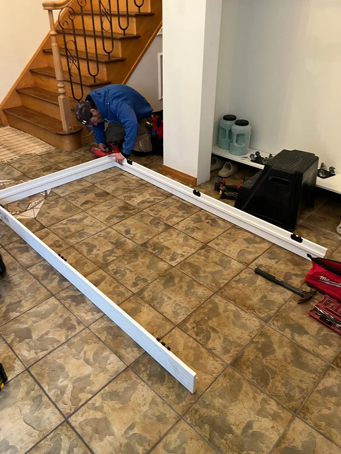 Technician assembling an interior door jamb and frame on site in Ottawa before hanging the door