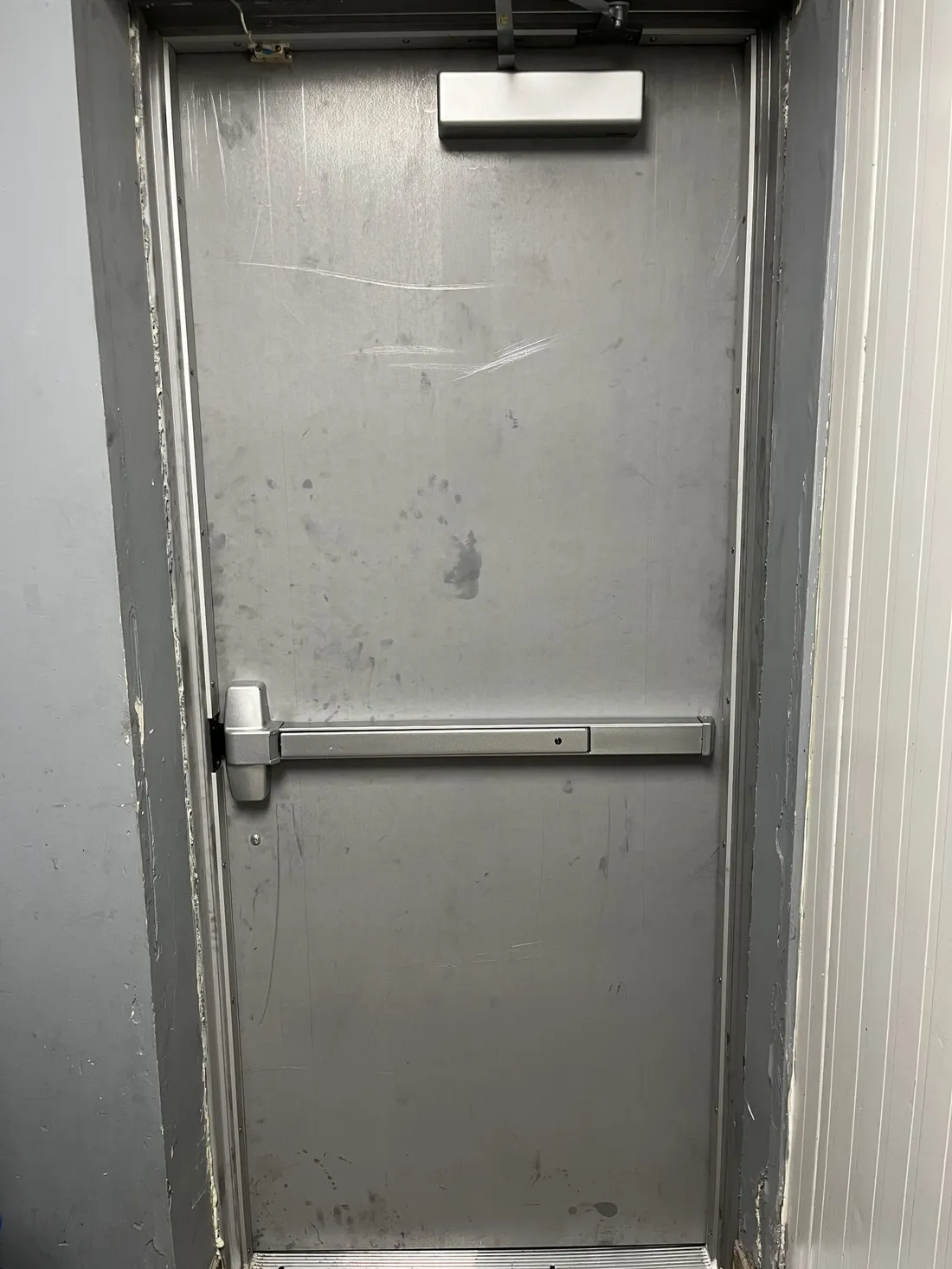 Commercial steel door with panic exit bar in Ottawa