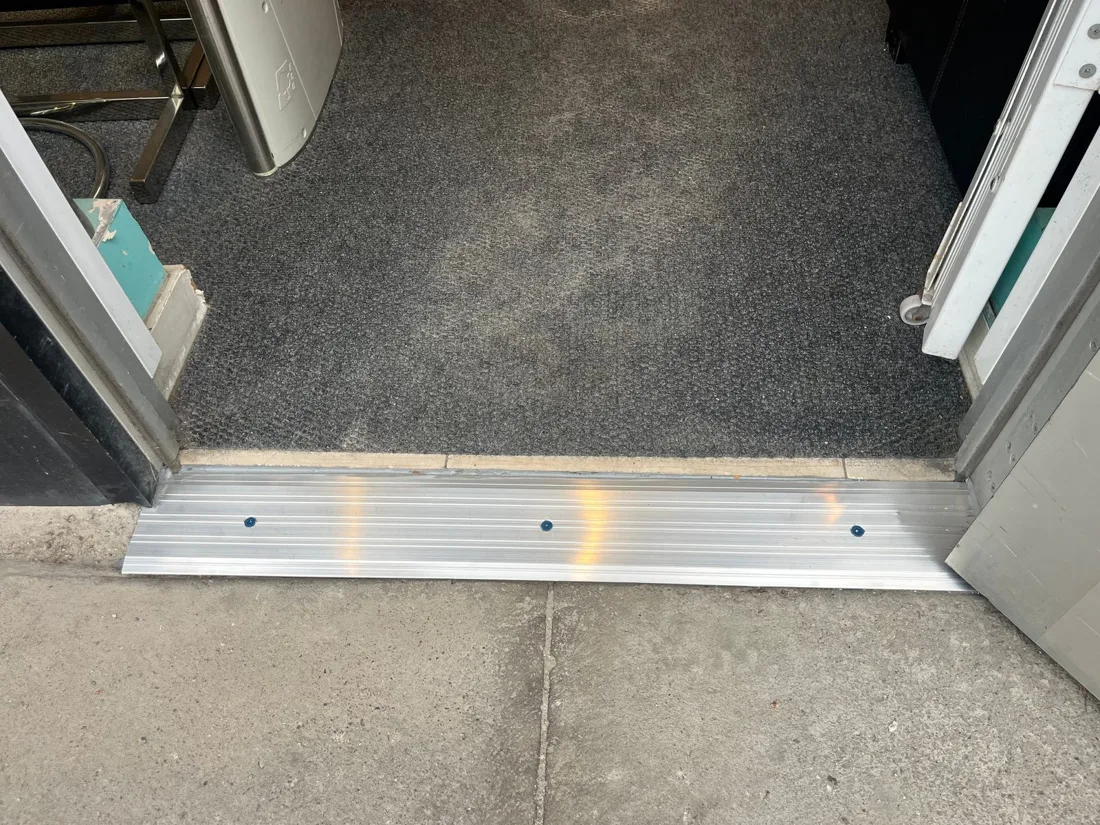 New aluminum threshold installed across a commercial entrance in Ottawa after replacement
