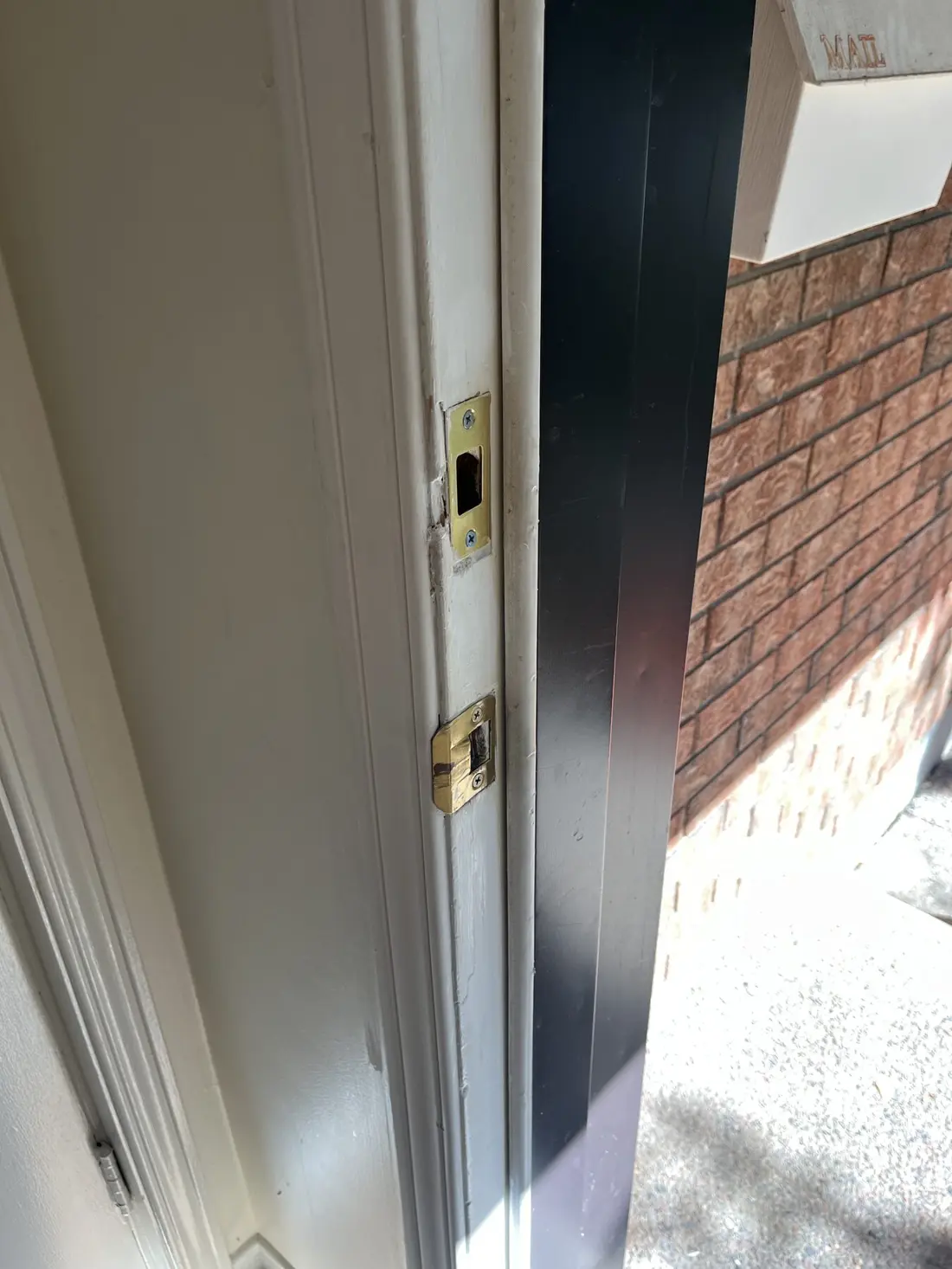 After repair: rebuilt Ottawa front door jamb with deadbolt and latch strike plates seated flush in solid new wood